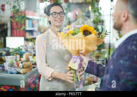 Woman Selling Flowers Stock Photo