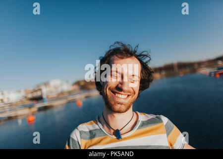 Portrait of happy laughing caucasian man with big toothy smile Stock Photo