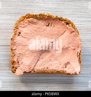 top view of bread sandwich with pate on gray wooden table Stock Photo