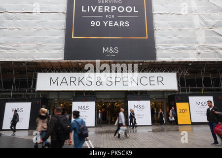 People walking past the Marks and Spencer store in Church St Liverpool UK, which is being refurbished. Stock Photo