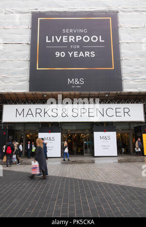 People walking past the Marks and Spencer store in Church St Liverpool UK, which is being refurbished. Stock Photo