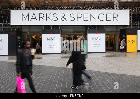 People walking past the Marks and Spencer store in Church St Liverpool UK, which is being refurbished. Stock Photo