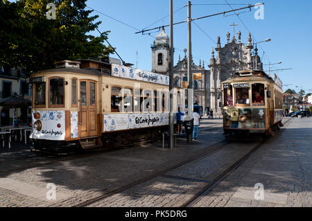 Trams seen in front of Carmo Church, in Porto, Portugal Stock Photo