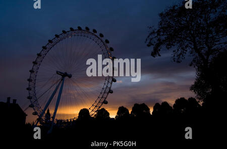 LONDON EYE, LONDON - JUNE 16 2011. Also known as Millennium Wheel. Shot during a dramatic sunset in mid summer in London. Stock Photo