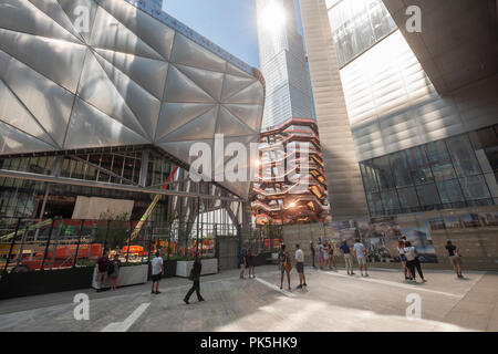 Tourists on the High Line amidst development in and around Hudson Yards, including 'The Vessel' and Tthe Shed', left, in New York on Saturday, September 1. (Â© Richard B. Levine) Stock Photo