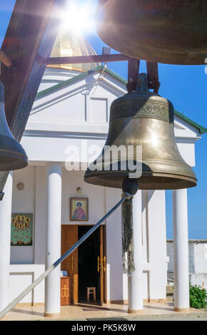 copper bell in Balaklava St. George Monastery on Cape Fiolent, Sevastopol Ukraine, summer day Stock Photo