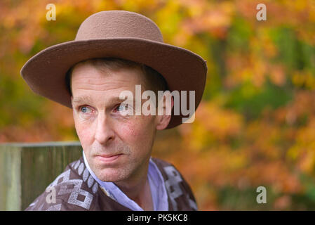 A headshot of a middle aged man wearing a cowboy style hat Stock Photo