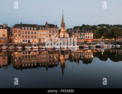 Honfleur, France – is a truly picturesque and charming harbor located in the Seine estuary where the Seine meets the Atlantic Coast. Stock Photo