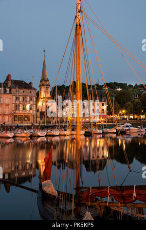 Honfleur, France – is a truly picturesque and charming harbor located in the Seine estuary where the Seine meets the Atlantic Coast. Stock Photo