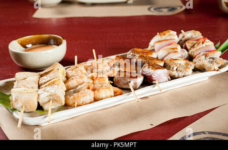 Mixed skewers, chicken meat, fish and cow. Stock Photo