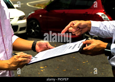 The insurance agent working claim process in payment on from parties .Insurance claim concept . Stock Photo