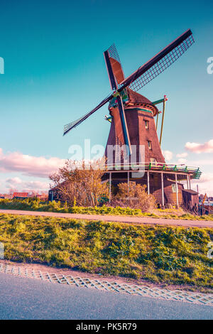 Authentic Zaandam mills on the water channel in Zaanstad village. Zaanse Schans Windmills and famous Netherlands canals, Europe. Instagram toning. Stock Photo