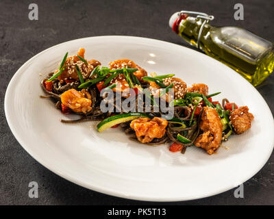 Buckwheat noodles. Soba, onion, carrots, Bell pepper, chicken thighs, chili peppers, zucchini, green onions. Stock Photo