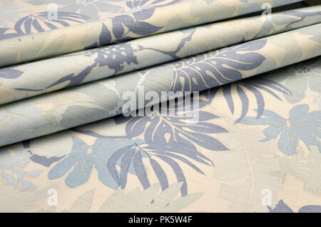 Cotton fabric with elastane, stretch stretch, in large beige-blue floral ornament Stock Photo