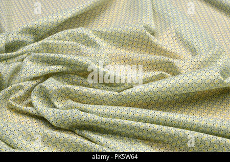 Cotton fabric, cambric with light yellow - green geometric ornament Stock Photo