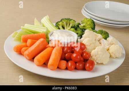 A party plate loaded with vegetables and ranch dressing Stock Photo