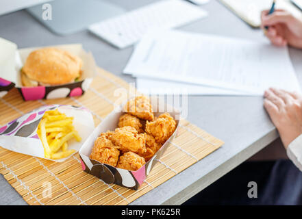 lunch time at the work place. Fast food delivery concept image Stock Photo