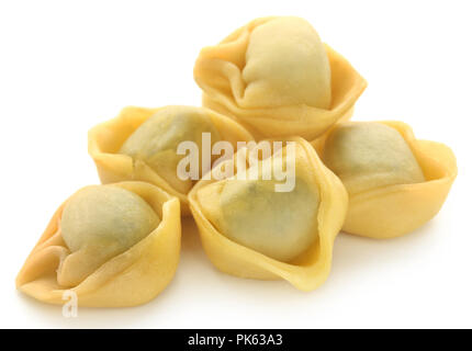 Italian Tortelloni made of spinach and wheat flour over white background Stock Photo