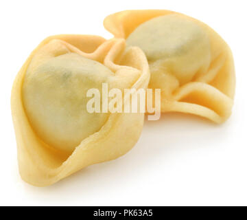 Italian Tortelloni made of spinach and wheat flour over white background Stock Photo