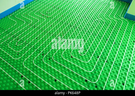 Green floor heating system - hydro installation with pipes Stock Photo