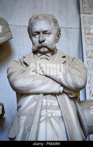 Picture and image of the late borgeoise realistic style stone sculpture of the Gallino tomb sculpted by  G. Moreno 1894.  In the tomb, the bust that p Stock Photo