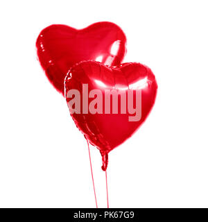 two red heart shaped helium balloons Stock Photo