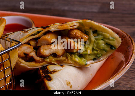 Pork Burrito with French potato Stock Photo