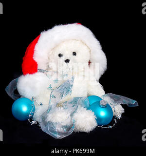 Teddy Bear in Santa Hat with Blue Christmas Ornaments Stock Photo