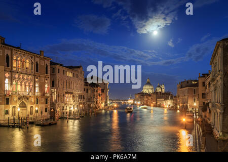 The moon shines over Venice. Picture taken from the Academy bridge. Italy. Stock Photo