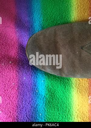 Slipper on multi colored background. Stock Photo