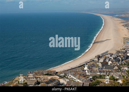 Looking west along Chesil beach on a sunny day with an onshore wind creating some surf. Dorset England UK GB Stock Photo