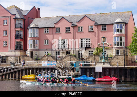 Rowers going past Butts Ferry River Exe Exeter Quay Exeter Devon England Stock Photo