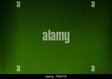 Background surface of green and black plastic material with dots Stock Photo