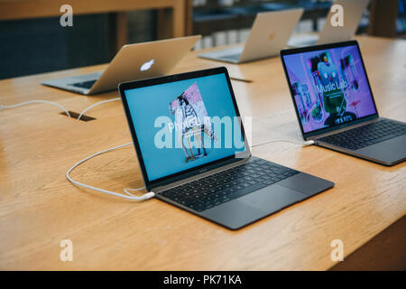 Berlin, August 29, 2018: Retail sale of new MacBooks in the official store of Apple in Berlin. Modern and stylish laptops. Stock Photo