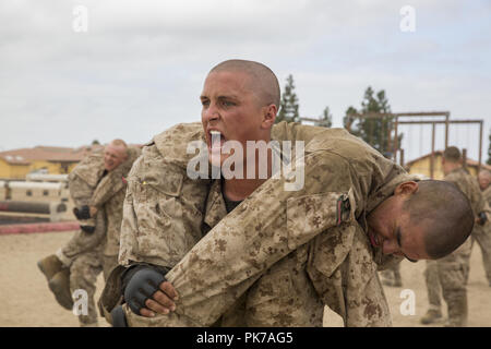 September 10, 2018 - Marine Corps Recruit Depot San D, California, United States - A recruit with Charlie Company, 1st Recruit Training Battalion, fireman carries another recruit during a combat conditioning exercise at Marine Corps Recruit Depot San Diego, Sept. 5. Recruits conduct physical training on a daily basis to stay conditioned for the various events they encounter throughout training. Annually, more than 17,000 males recruited from the Western Recruiting Region are trained at MCRD San Diego. Charlie Company is scheduled to graduate Nov. 9. U.S. Department of Defense via globallookpr Stock Photo