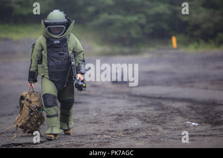 Camp Fuji, Shizuoka, Japan. 10th Sep, 2018. Sgt. Scott N. Schaller walks back from X-raying a suitcase Sept. 5, 2018 at Camp Fuji, Japan. Explosive Ordnance Disposal technicians use an X-ray to determine if they can safely inspect items. EOD Company Marines validated proficiency and prepared for worldwide mission deployment in support of III Marine Expeditionary Force by testing their ability to disable and dispose of explosives. Schaller, a native of Easton, Pennsylvania, is with EOD Company, 9th Engineer Support Battalion, 3rd Marine Logistics Group. (U.S. Marine Corps photo by Lance C Stock Photo