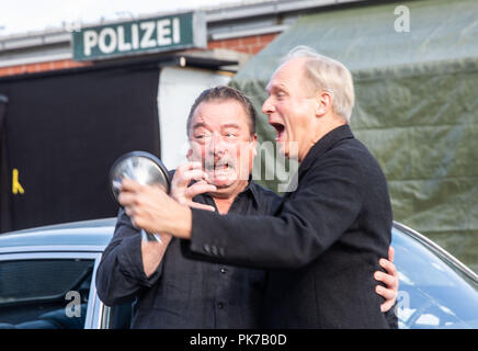 Friedberg, Hessen. 11th Sep, 2018. The actors Peter Kurth (l) and Ulrich Tukur (r) pose at a press event on the set at the edge of the shooting for a new crime scene of Hessichen Rundfunk (HR). The eighth HR crime scene with Ulrich Tukur is created under the working title 'The Attack'. Credit: Frank Rumpenhorst/dpa/Alamy Live News Stock Photo