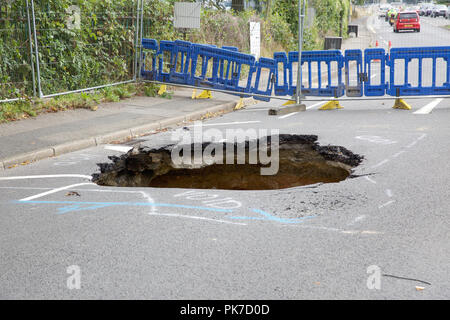 Biggin Hill,UK,11th September 2018,Thames Water are investigating a large sinkhole which appeared after a water leak in Biggin Hill, Kent. It appeared on the main Road which runs alongside Biggin Hill Airport. Travel chaos has ensued with 3 way traffic lights having a knock on effect especially during rush hour. Credit Keith Larby/Alamy Live News