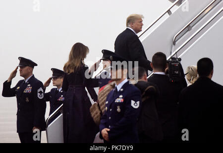 Joint Base Andrews, Maryland, USA. 11th Sep, 2018. United States President DONALD J. TRUMP and First Lady MELANIA TRUMP walk to Air Force One before departing from Joint Base Andrews, Maryland on September 11, 2018. The President and First Lady attend the Flight 93 September 11 Memorial Service in Shanksville, PA. Credit: Olivier Douliery/CNP/ZUMA Wire/Alamy Live News Stock Photo