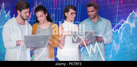 Composite image of business people discussing over laptop Stock Photo