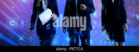 Composite image of low angle view of colleagues walking against white backgroound Stock Photo