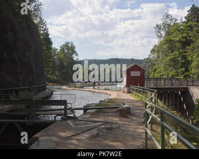 Håverud in Dalsland province Sweden,where the tourist attraction Dalslands canal passes through locks and an aqueduct, footpath by the canal Stock Photo