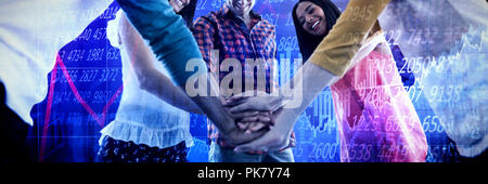 Composite image of low angle view of business people huddling hands Stock Photo