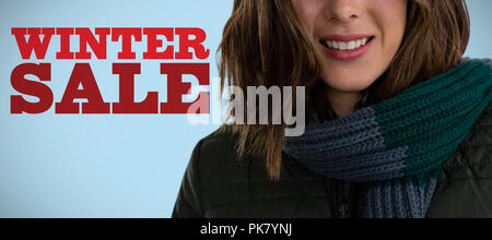 Composite image of close up portrait of smiling woman in scarf Stock Photo