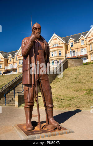 UK, England, Yorkshire, Filey, promenade, A high tide in short wellies steel fisherman sculpture by Ray Lonsdale Stock Photo