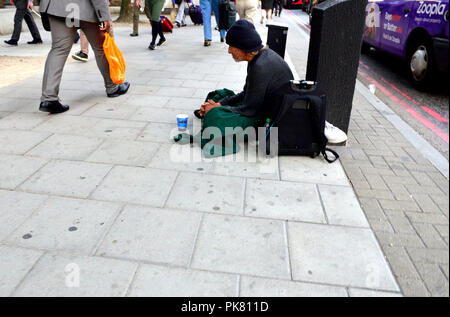 Homeless man in the street, central London, England, UK. Stock Photo