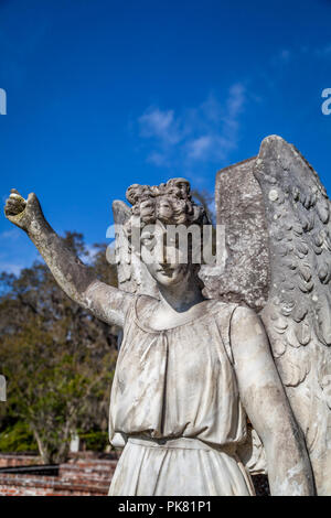 Stone angel over a gravesite. Stock Photo