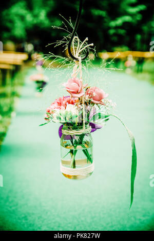 Indie Wedding Fresh Flower Outdoor Aisle Decoration Stock Photo