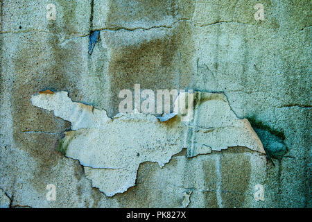 Grunge old concrete wall with peeling paint. Stock Photo