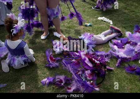 Hackney Carnival September 9th 2018. A young performer from the 'Colour Purple' group (based on the book by Maya Angelou) has a rest Stock Photo